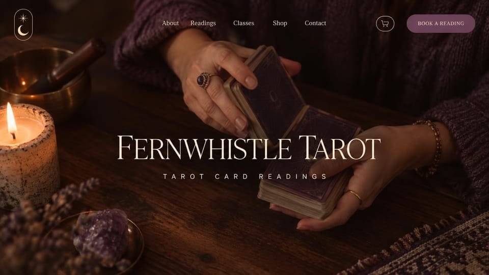 Astrology website design, tarot readings with hands shuffling the deck: dark warm photo of hands in a purple sweater shuffling tarot cards beside a candle and amethyst, a large centered cream serif name and a mauve button