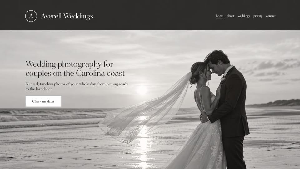 Wedding photographer website design, black and white coastal photographer with a windblown veil: charcoal header with a circle monogram, a wide black and white photo of a couple embracing on a beach as the veil blows, a dark serif headline and a white date button
