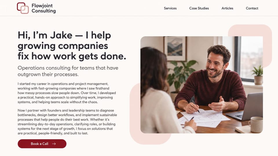 Consulting website design, operations consultant with a first-person story: warm white page, a dark headline, two short paragraphs, a burgundy call button and a photo of a consultant smiling across a table of sketches
