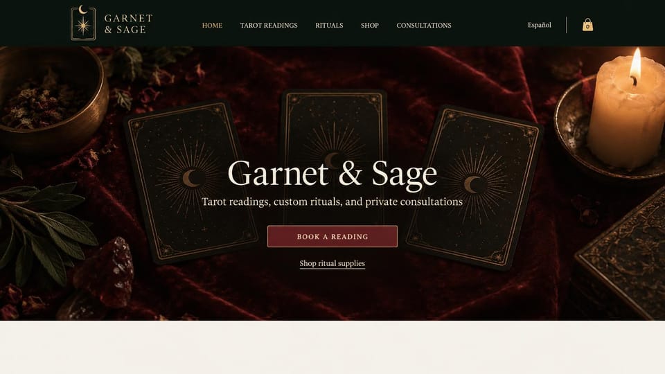 Astrology website design, tarot, rituals and a shop in deep red: candlelit still life of black tarot cards on deep red velvet, a centered cream serif name and a garnet button