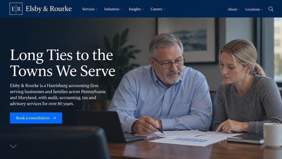 Accounting website design, cPA firm with long roots in its towns: dark navy header, a white serif headline over an older and a younger accountant reviewing papers, a blue consultation button