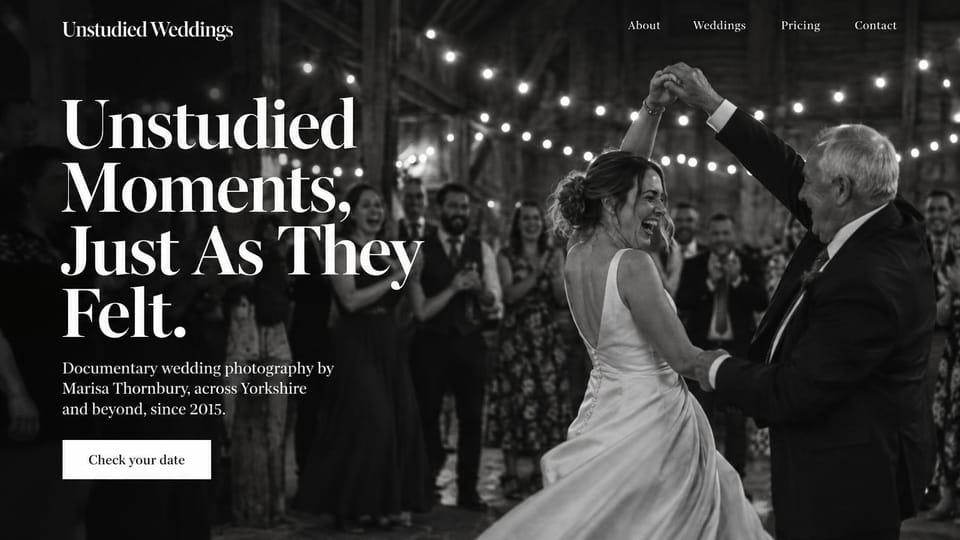 Wedding photographer website design, documentary wedding photographer with a twirl under string lights: full-screen black and white photo of a bride twirling with an older man under string lights as guests clap, a huge white serif headline and a white date button