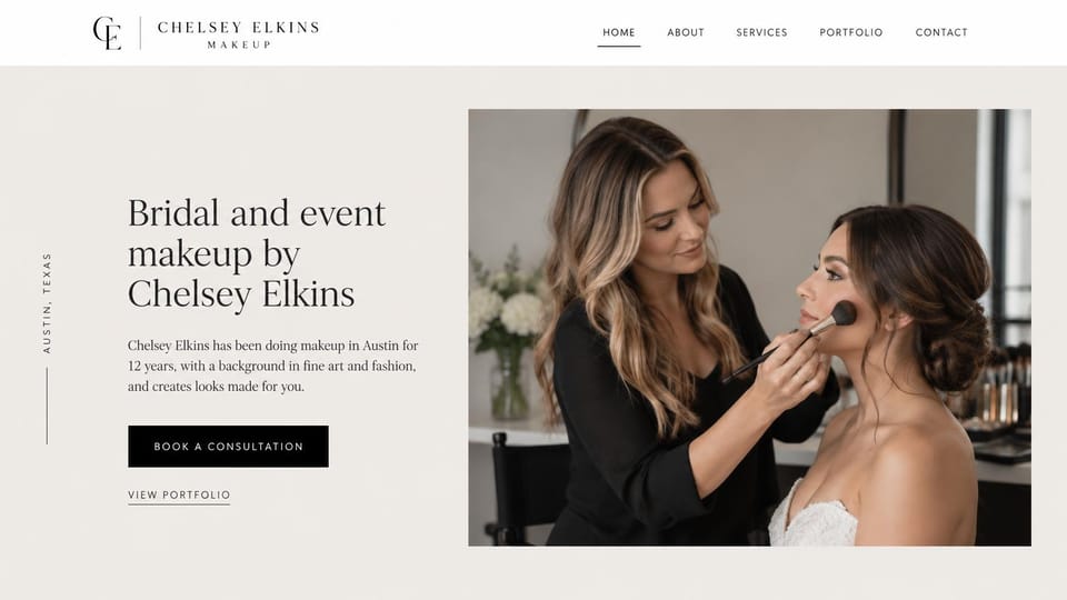Makeup artist website design, bridal and event makeup artist with her city down the side: light ivory page, a monogram logo, a vertical city label, a dark serif headline, a black consultation button and a photo of an artist brushing blush on a bride