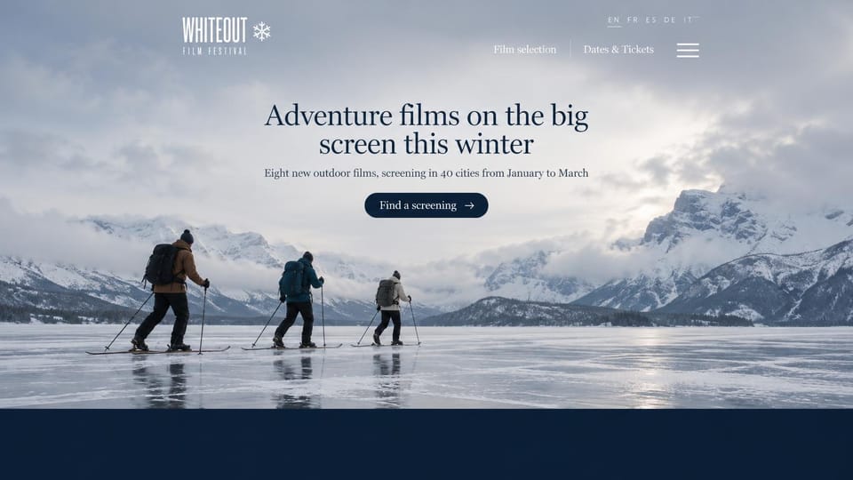 Event website design, touring outdoor film festival over a frozen lake: pale blue-gray photo of skiers crossing a frozen lake below snowy mountains, centered navy serif headline, navy screening button, language switch in the header