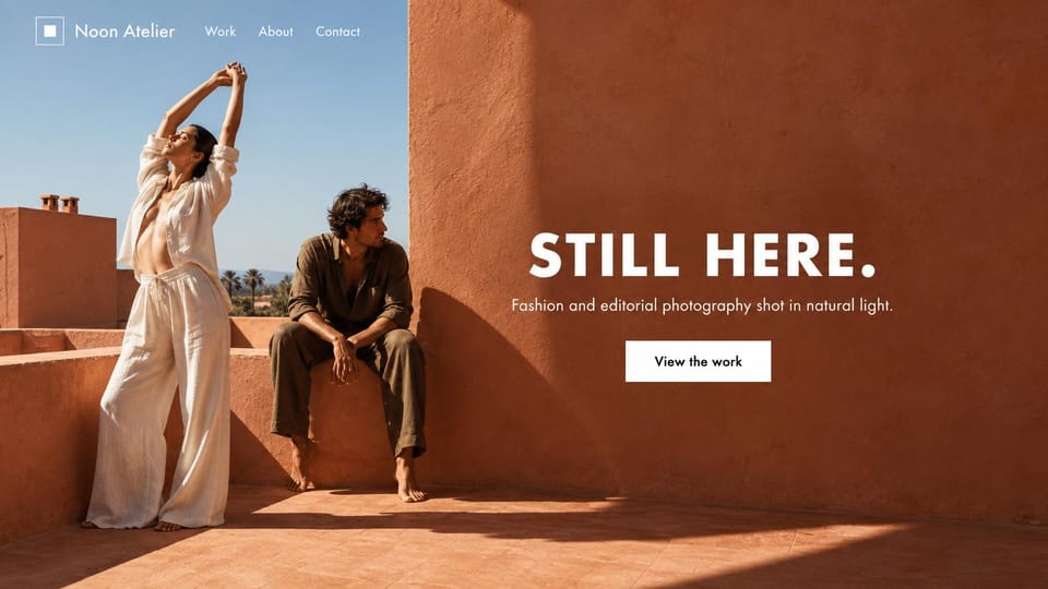 Photography website design, fashion editorial on a terracotta rooftop: two models on a sunlit terracotta rooftop, a large white headline and a white view the work button
