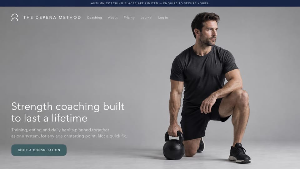 Personal trainer website design, lifelong strength coaching in a quiet gray studio: navy top bar, a light gray studio photo of a man kneeling with a kettlebell, a thin white headline on the left, a muted teal consultation button