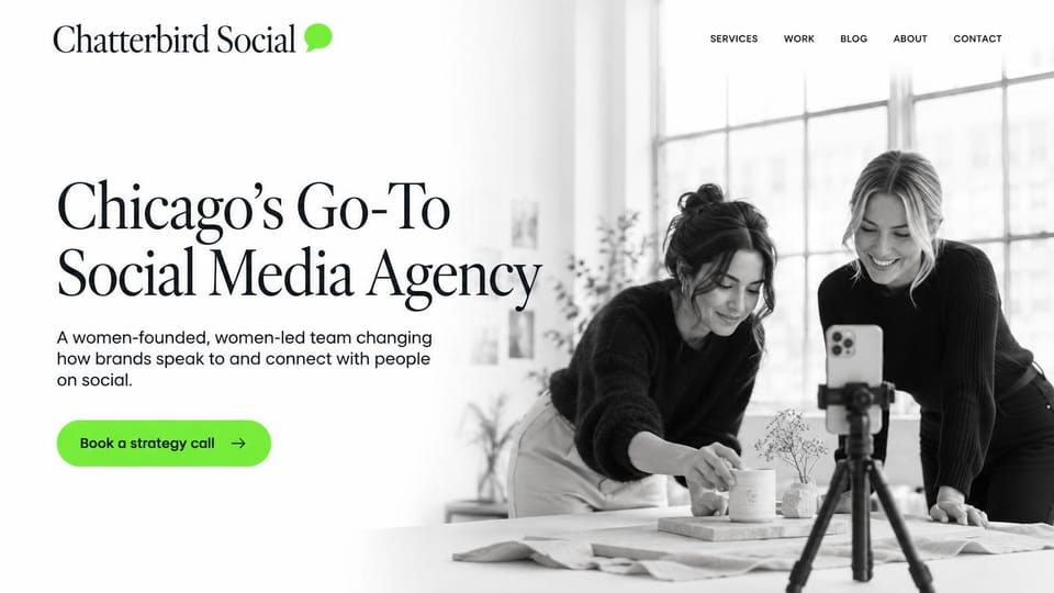 Business website design, social media agency with a content shoot in the hero: white page fading into a black and white photo of two women filming a product on a phone tripod, a black serif headline and a lime green button
