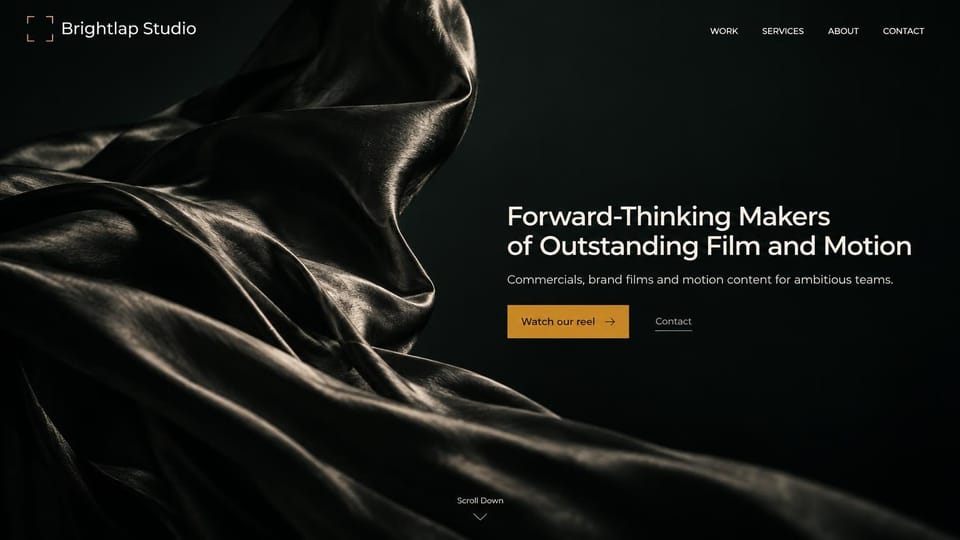 Videographer website design, commercials and motion on black satin: glossy black satin folds, white sans headline at right, gold reel button and a contact link