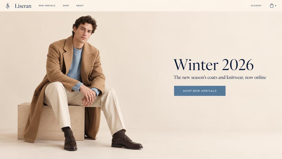 Fashion website design, winter menswear on a pale cream backdrop: cream studio, a young man on a plywood block in a camel overcoat, pale blue sweater, cream trousers and loafers, a navy serif headline and a steel blue button