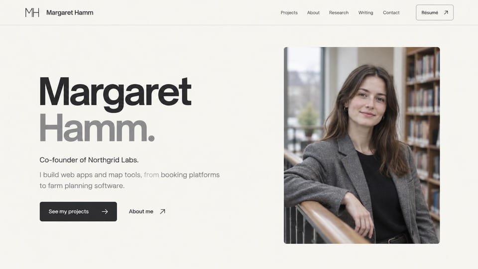 Resume website design, software founder with an oversized name: warm off-white page, a huge black and gray name beside a portrait of a woman leaning on a library railing