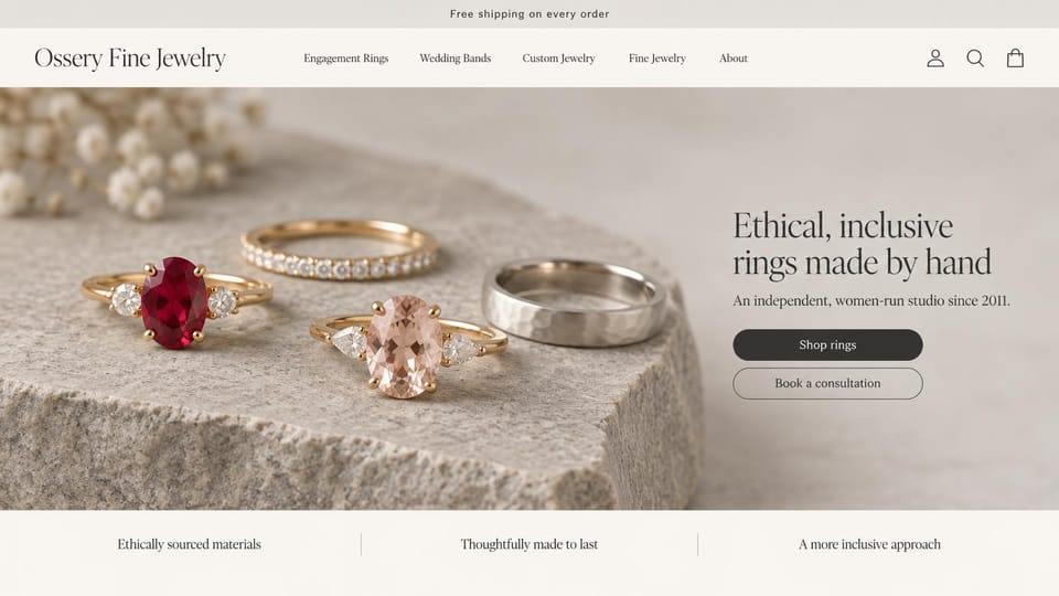 Jewelry website design, ethical engagement rings made by hand: cream page, gemstone engagement rings and wedding bands on a rough stone, a dark serif headline and two rounded buttons