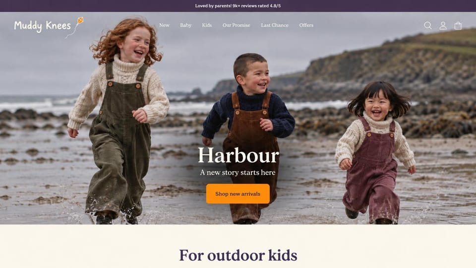 Fashion website design, kids' outdoor clothes on a rocky beach: plum top bar, three laughing kids running across a wet rocky beach in cord dungarees and chunky knits, a white serif headline, an orange button and a cream band below