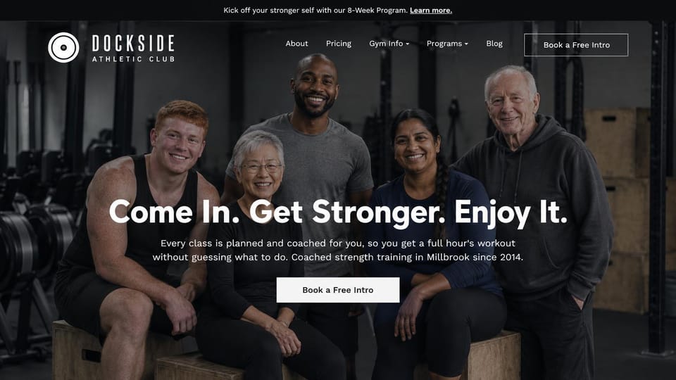 Landing page website design, strength gym with a member group photo: dark gym, five smiling members of different ages seated on wooden boxes behind a centered white headline