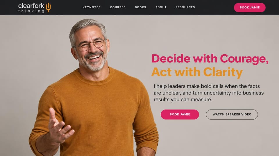Speaker website design, leadership speaker with courses and books: black top bar over a warm grey photo of a smiling man in an orange sweater, magenta and orange sans headline, magenta button