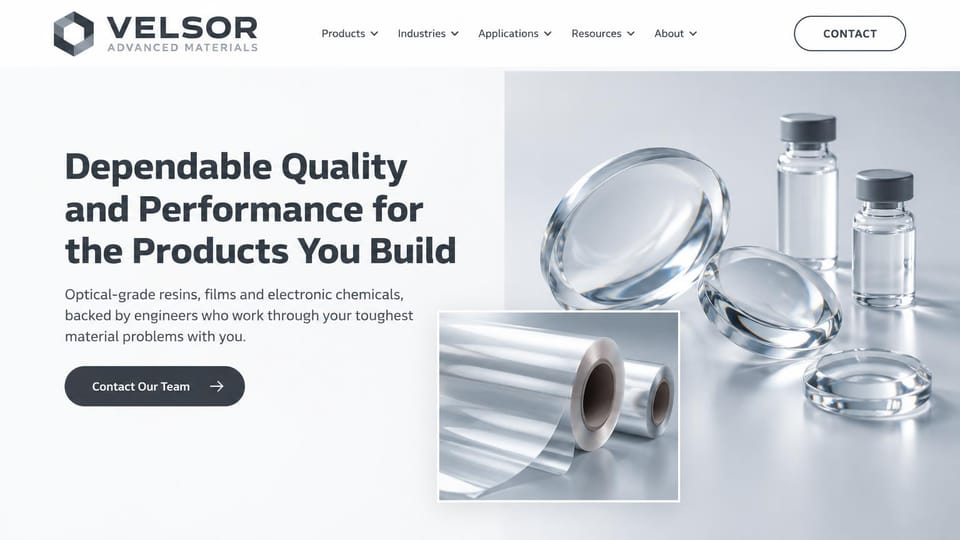 Manufacturing website design, materials supplier, clean and light: white and pale gray page, a dark gray hexagon logo, a bold charcoal headline, a dark pill button and photos of clear lenses, vials and film rolls