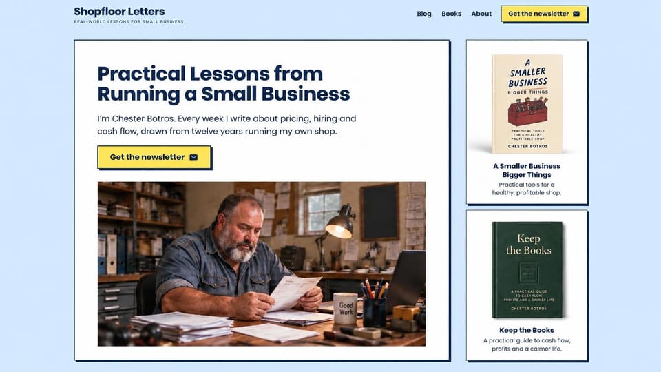 Blog website design, small business letters with books: pale blue page, a navy headline, a shop owner reading papers and two book covers in a side column