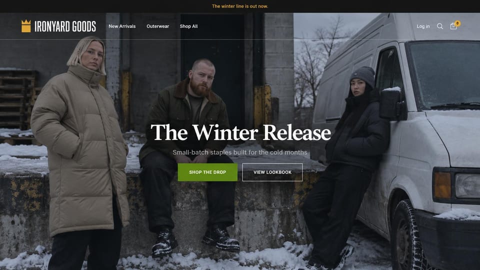 Fashion website design, winter streetwear drop on a snowy loading dock: dark photo of three people in a beige puffer, a waxed jacket and a black parka at a snowy loading dock beside a white van, a gold crown logo, a white serif headline, a green button and an outlined button