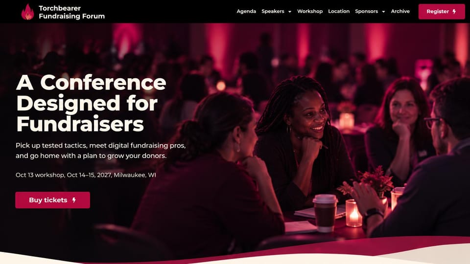 Event website design, nonprofit fundraising conference in deep magenta: black header with a flame logo, dark magenta photo of attendees talking at round tables, white headline, crimson ticket button, crimson wave below