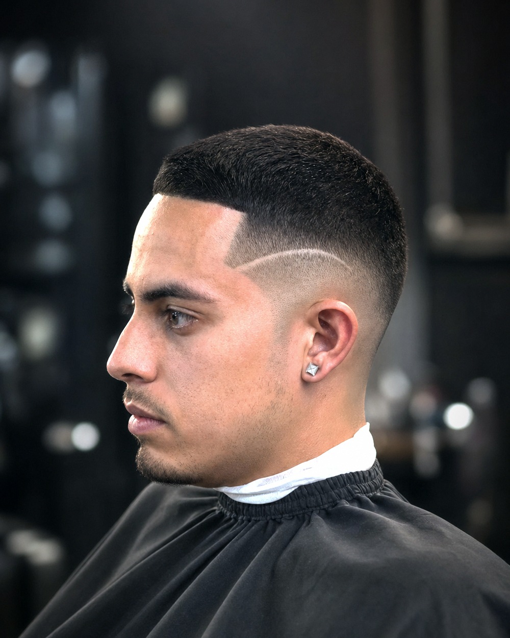 Skin fade with a hard part cut in
