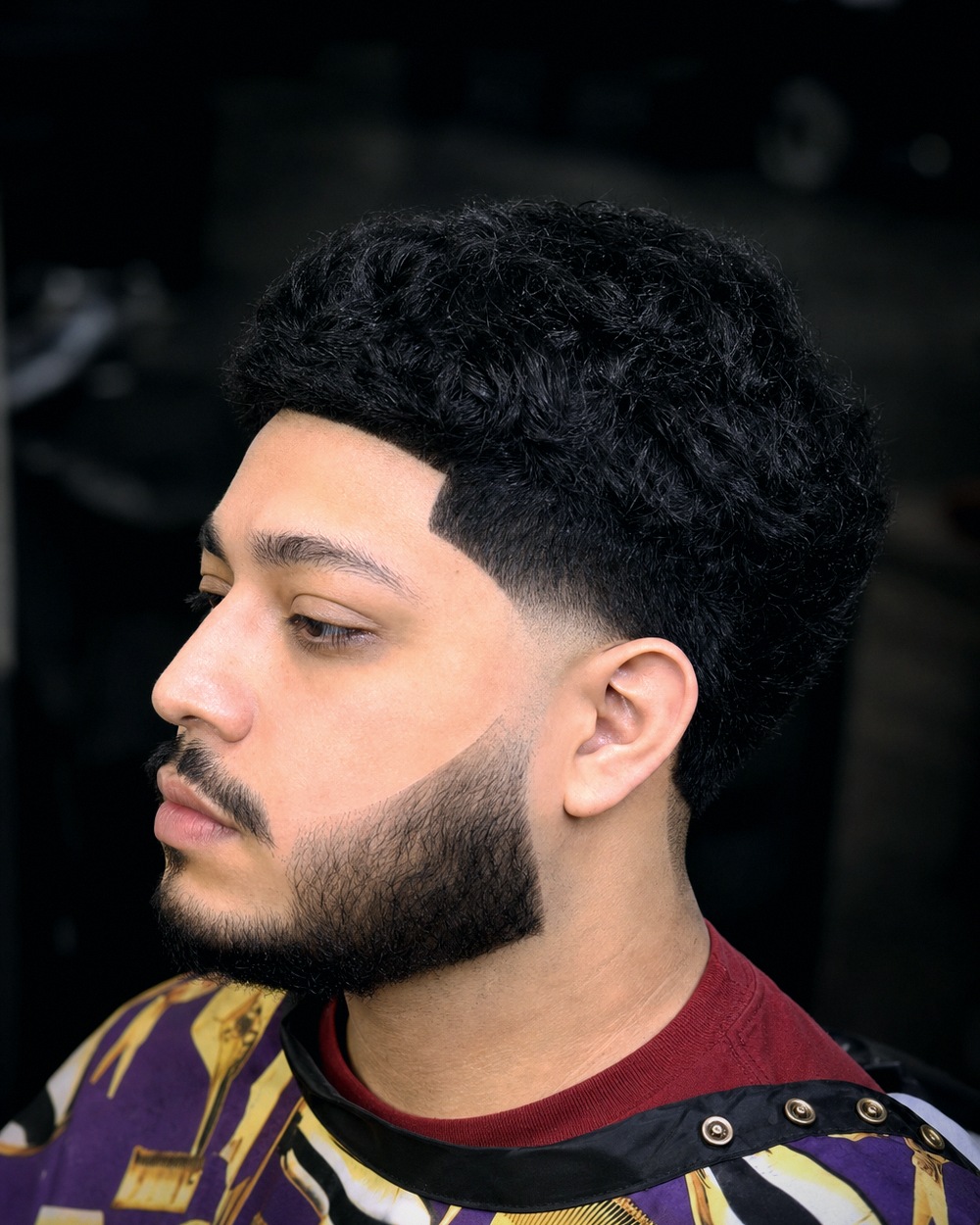 Textured curly top left long over a taper